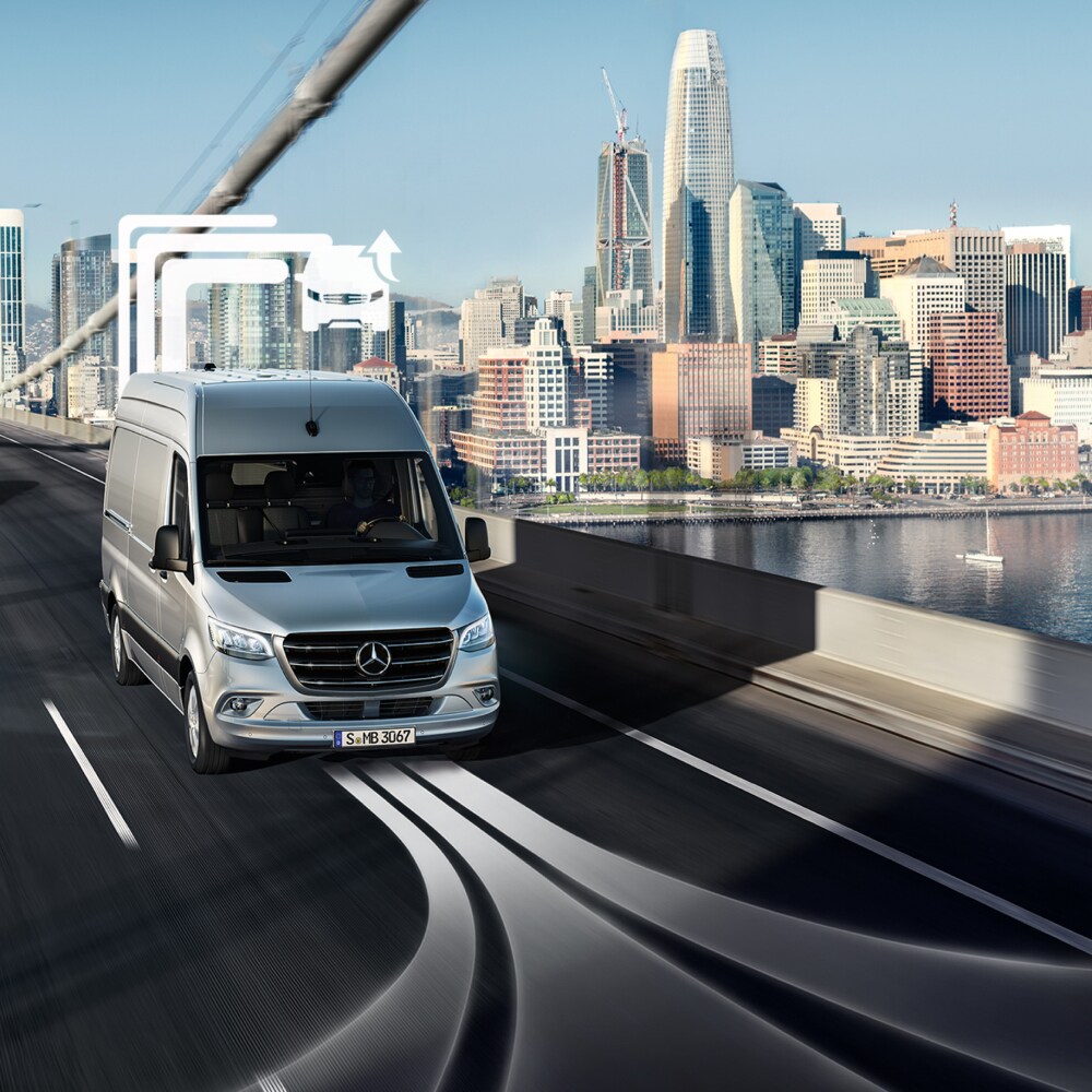 Van Uptime Monitor | Digital Extras | Mercedes-Benz A Mercedes-Benz Vans transporter drives across a multi-lane bridge at day.
